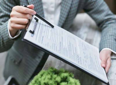 An illustrative image of a homeowners insurance form with fields for personal information and policy details.